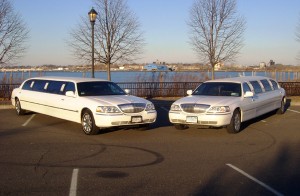 Two 10 Passenger White Limos